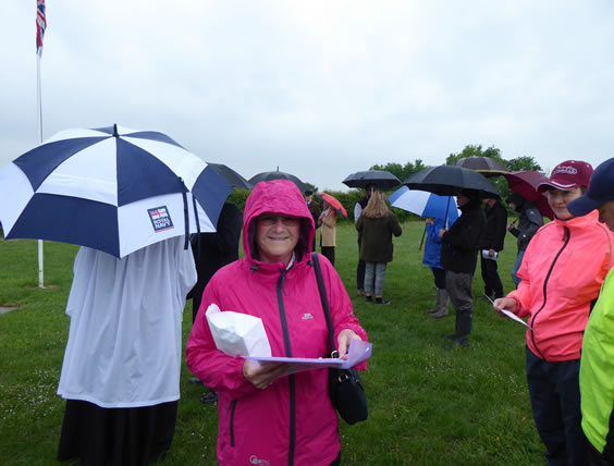 Suzanne  distributes 'Order of service' sheets